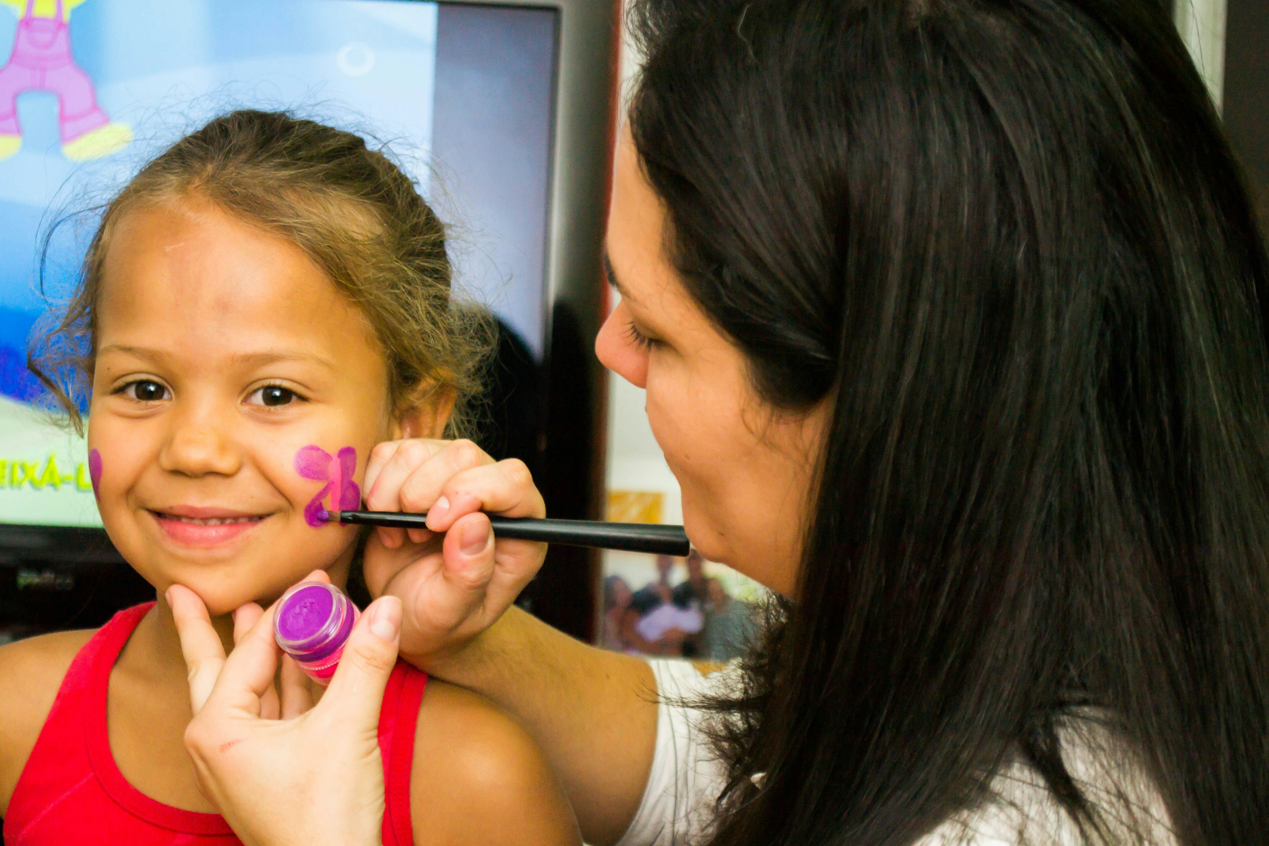 Child getting face painted